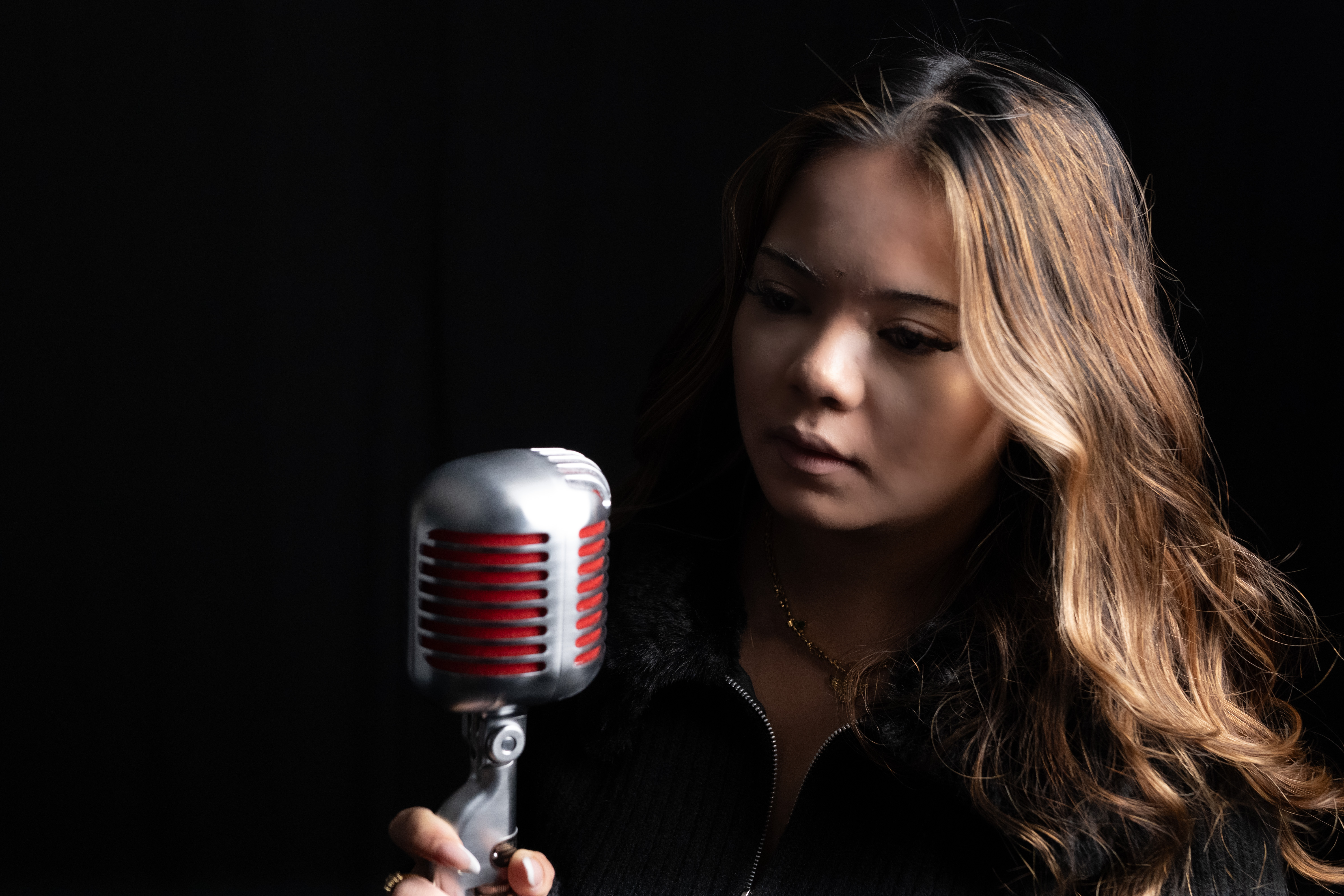 Singer promotional portrait with a vintage microphone created by Next Stages