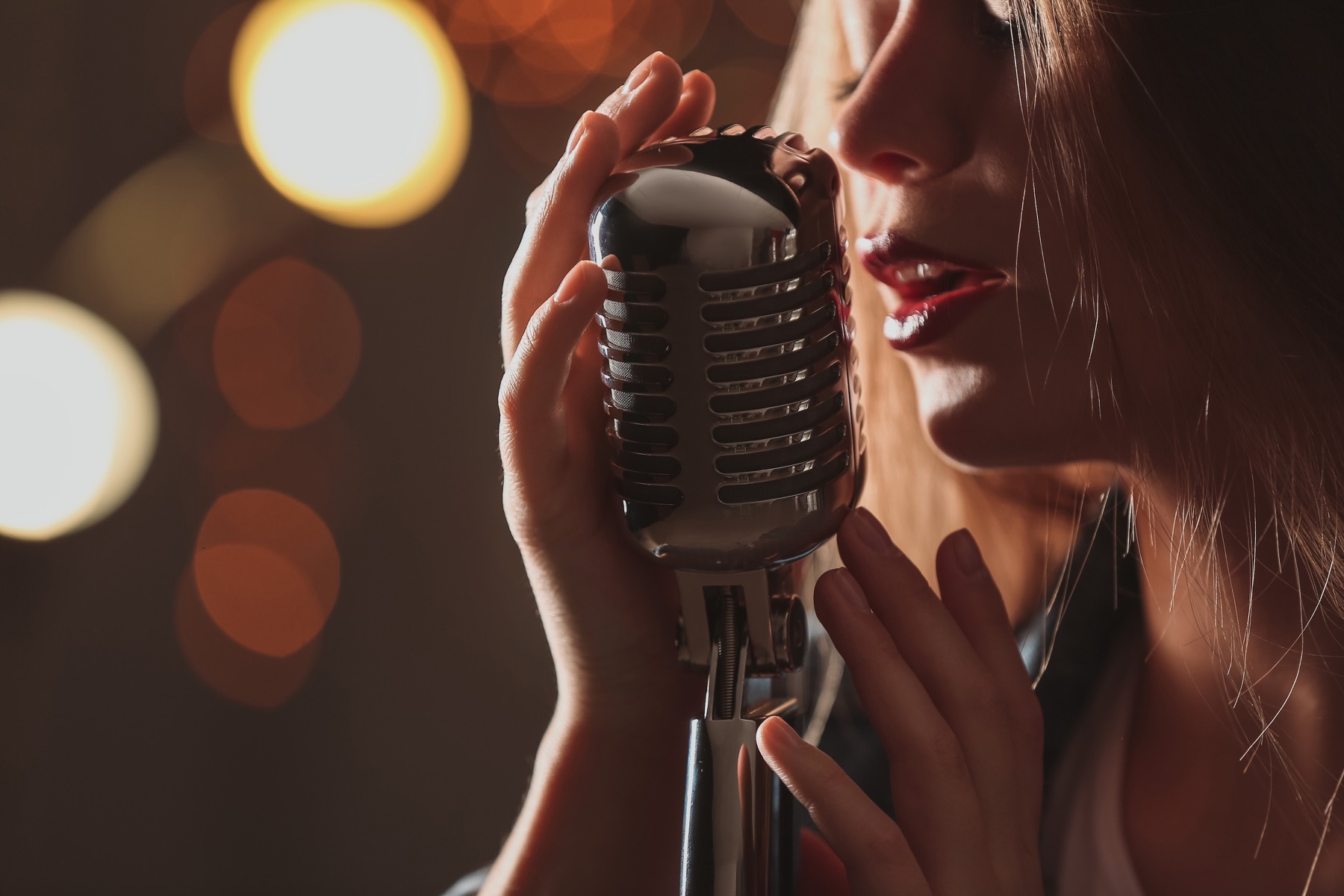Singer performing with a studio microphone